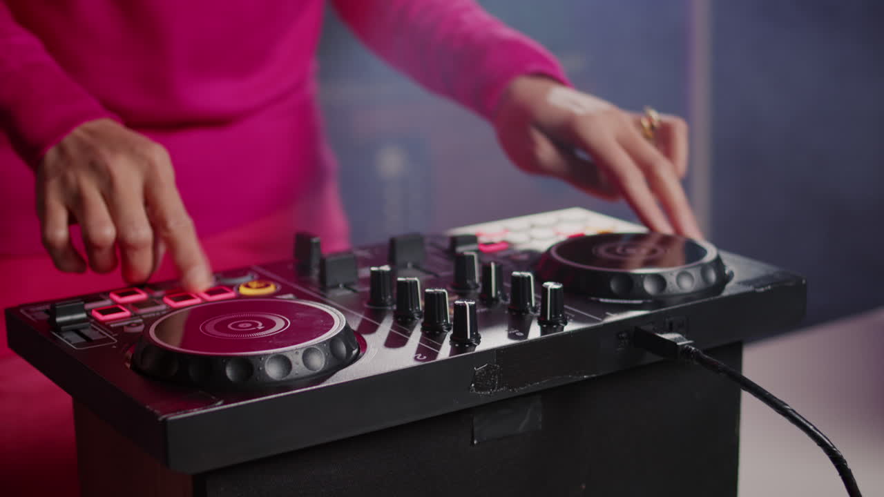 DJ using a DJ controller