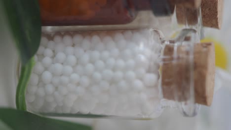 homeopathic globules in glass bottles