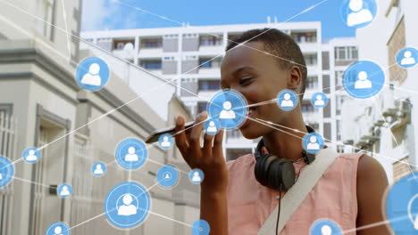 animation of network of connections over african american woman using smartphone