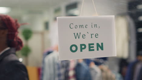 worker opening fashion boutique