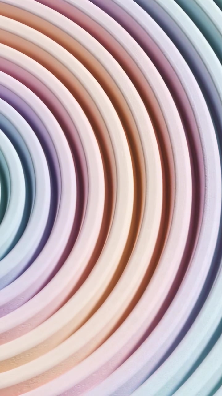 Vertical video: Shifting camera revealing concentric rings in studio highlighting pastel grooves