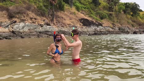 couple snorkeling at the beach