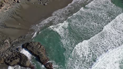 4K-Drone-footage-zooming-out-of-waves-near-cliffs-and-rocks-in-Brookings-Oregon-Samuel-Boardman-Corridor