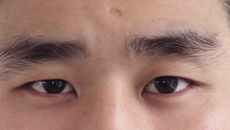 close-up-of-young-asian-man-eyes-open-looking-at-camera-reflection-on-iris