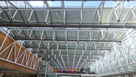 view of station's glass roof and busy interior