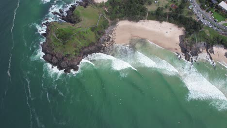 Foamy-Waves-Coming-To-The-Sandy-Shoreline-Of-Cove-And-Cabarita-Beach-In-New-South-Wales,-Australia