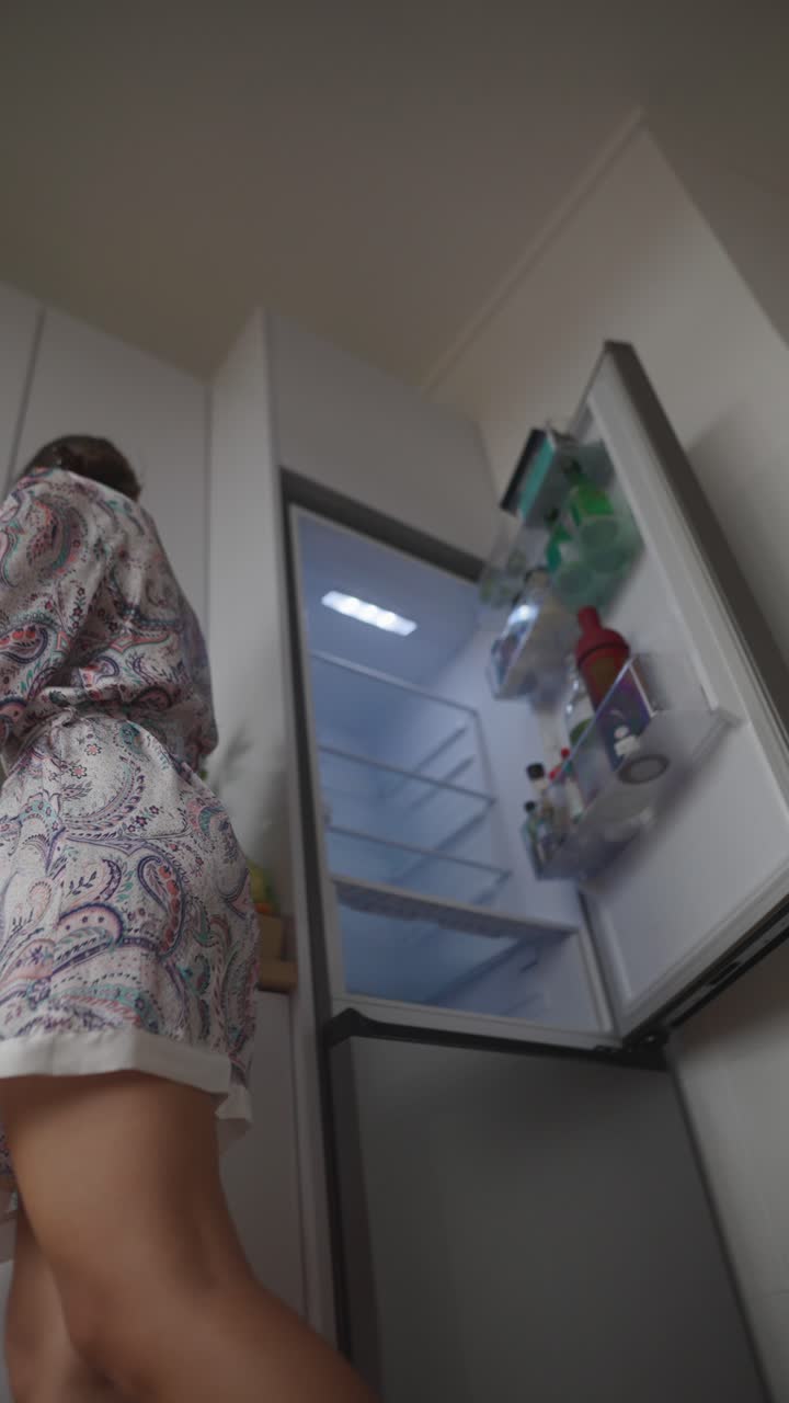 Woman in kitchen getting ready for breakfast