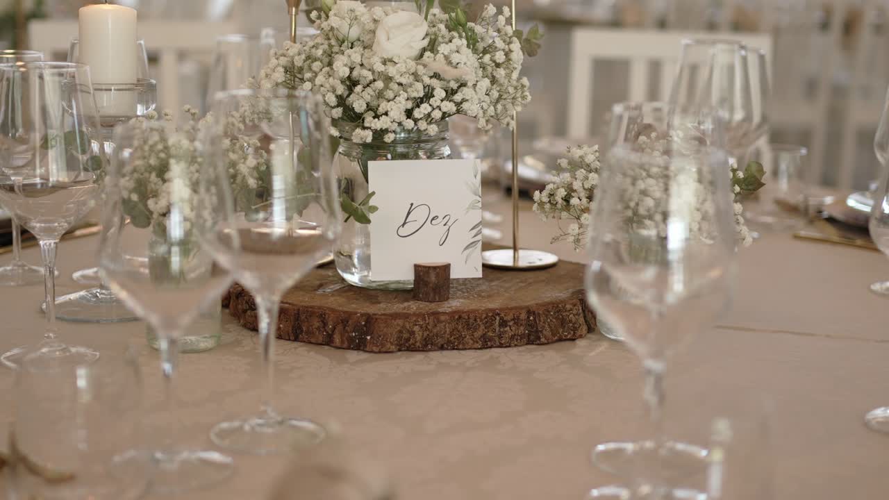 elegant table with white flowers candles and wood detail in soft tones