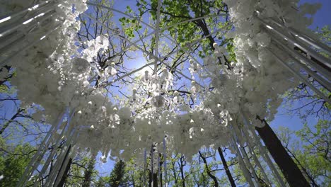 Wedding arch of white flowers in the park 01