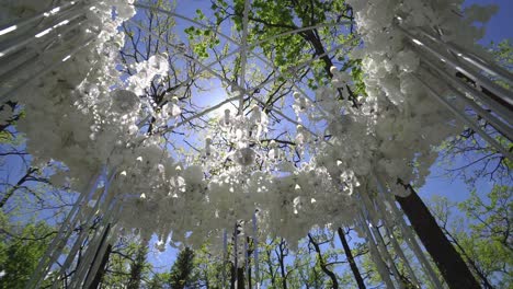 wedding arch of white flowers in the park 01