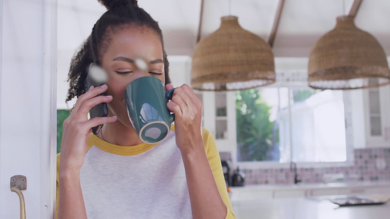 Woman taking call, holding mug and phone, animated charts sweeping over face, receding for business