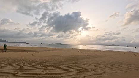 Wide-angle shots capture two people walking along a tranquil, palm-lined beach at sunrise, with soft natural lighting and gentle camera movement