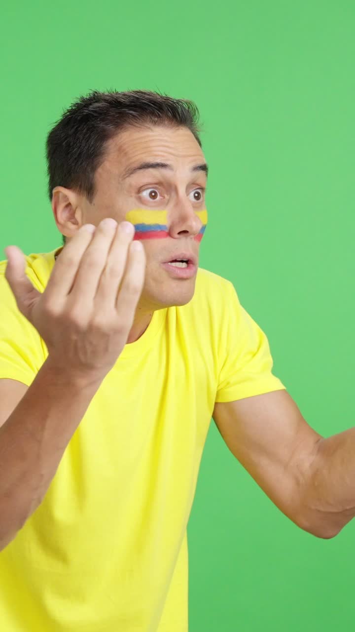 Man cheering for Colombia, angry with the decision of referee