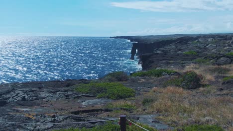 pacific ocean and iconic holei sea arch in hawaii, distance view