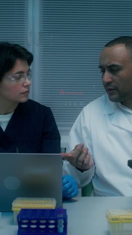 scientists discussing in a laboratory setting