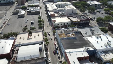 drone flight straight down east 8th avenue in ybor city, tampa, florida