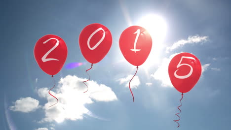 2015 balloons against blue sky