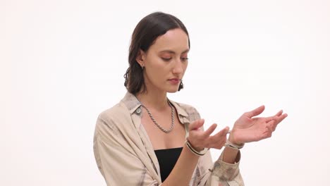woman with handcuffs on a white background