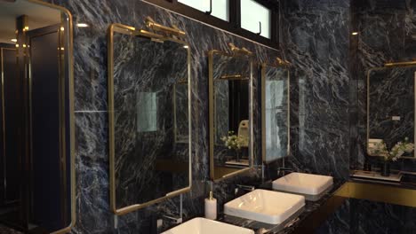 luxury and elegant black marble tile wall public restroom