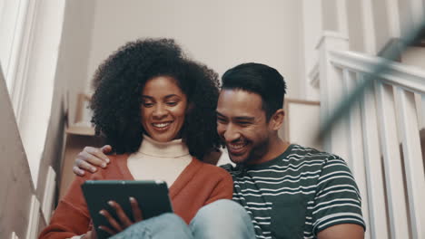 tablet, couple and smile on stairs in home