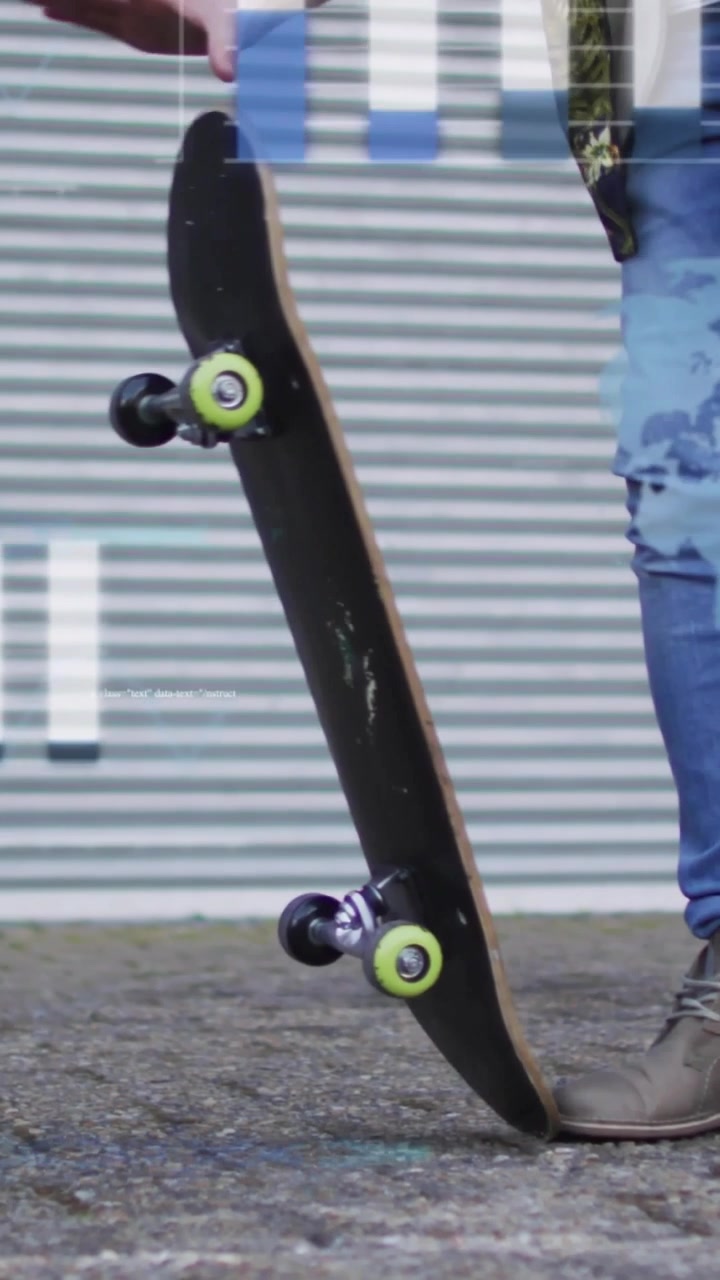 Vertical video: Skater foot pressing tail, lifting board upright to secure as blue tints sliding