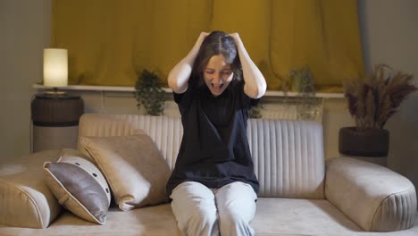 the young woman is shouting in anger at home.