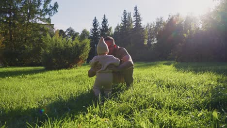 father and daughter playing in a park