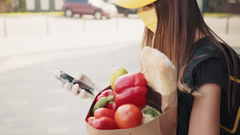 woman grocery delivery person in a city