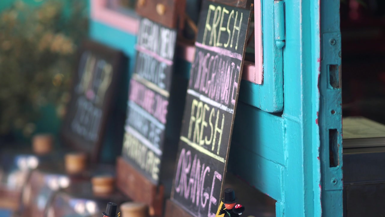 Colorful Chalkboard Menus Displaying Fresh Drinks and Vegan Food