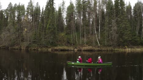 a-drone-footage-of-3-adults-canoeing-in-oulanka-national-park
