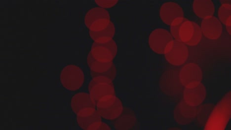 view of red blurry lights making fast blink pattern on dark background