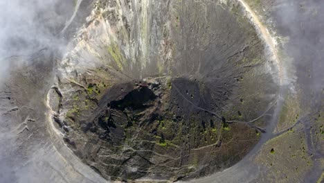 a top-down zoom-out reveals the vast, rugged landscape surrounding parícutin volcano in mexico