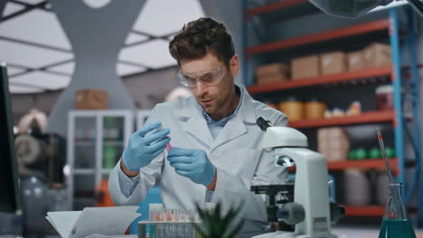 medical technician working laboratory researching new vaccination close up.