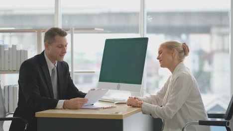 business man talk with young woman during job interview for the company