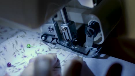 close up footage of sewing machine at night time