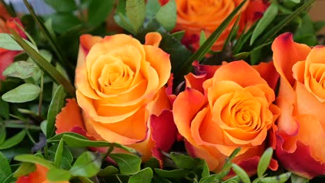 vibrant orange and red roses bouquet