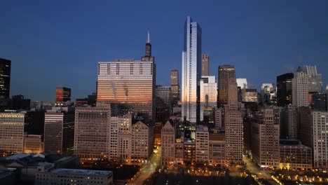 aerial view of reflecting skyscrapers at the east monroe street, winter dusk in chicago, usa