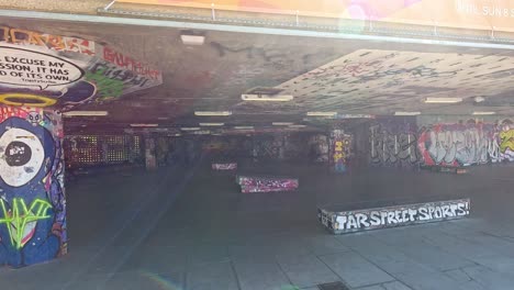 skateboarders performing tricks in urban skatepark