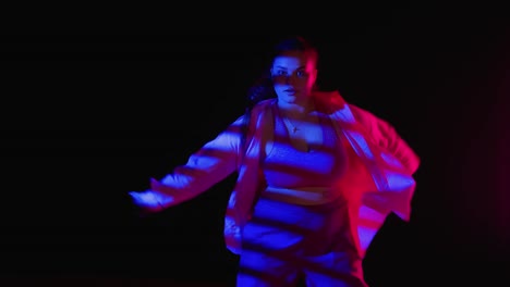 plus-size woman dancing in neon lights