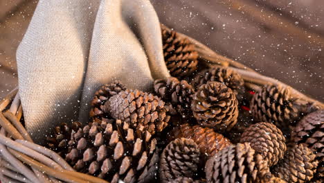 falling snow with christmas pine cones