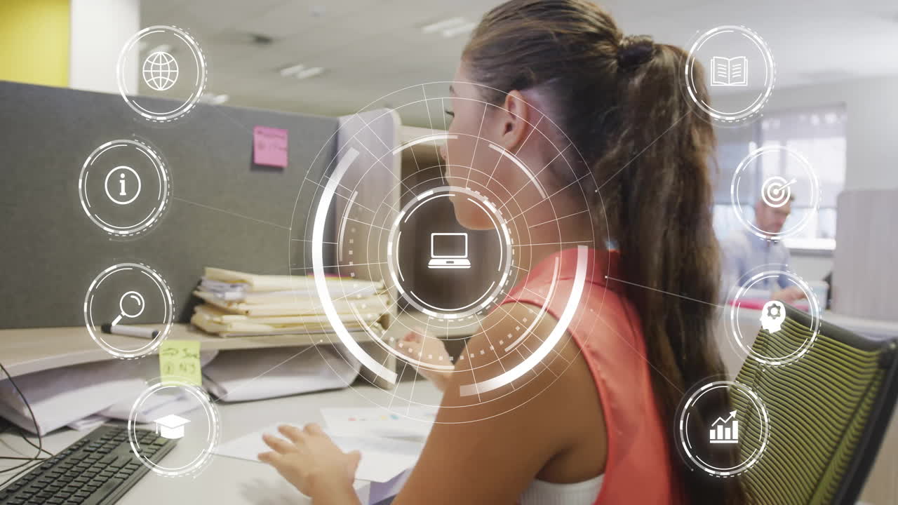 Working at desk, businesswoman interacting with animation of digital interface icons