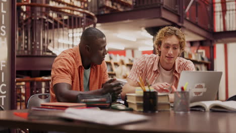 two students studying in the library