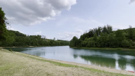 Shore-with-beach-of-reservoir-in-Germany-with-forest-on-the-edge-Aggatalspeere