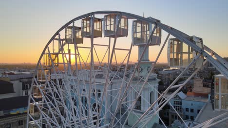 kyiv, ukraine in the morning at dawn: ferris wheel