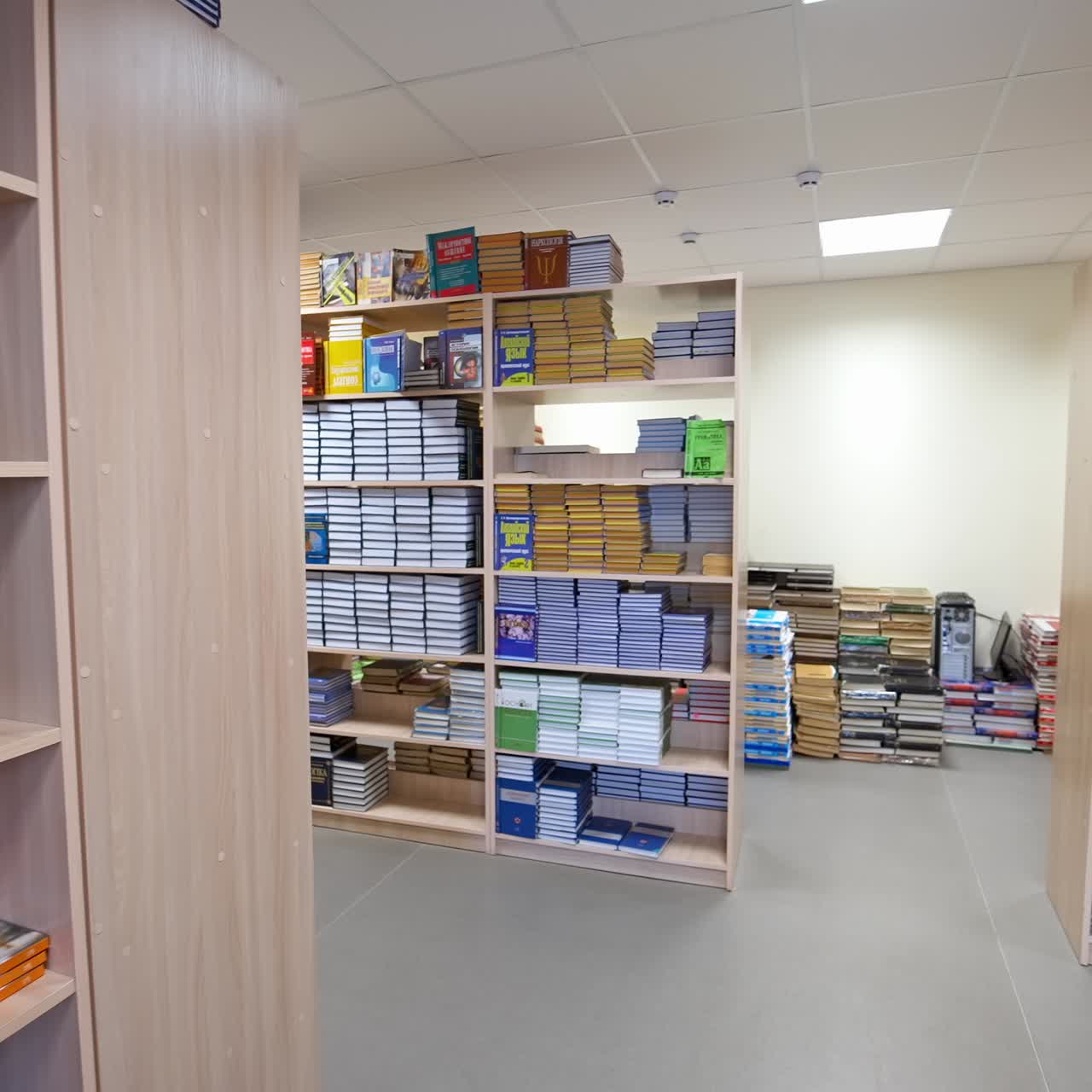 Bookshelves in university library. Interior of the library with shelves full of books