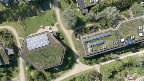 top down aerial of beautiful earthship district - drone lifting up