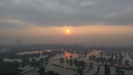 Sunrise over Waterlogged Farmlands