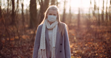 Woman-Putting-On-Protective-Mask-Against-Coronavirus-4