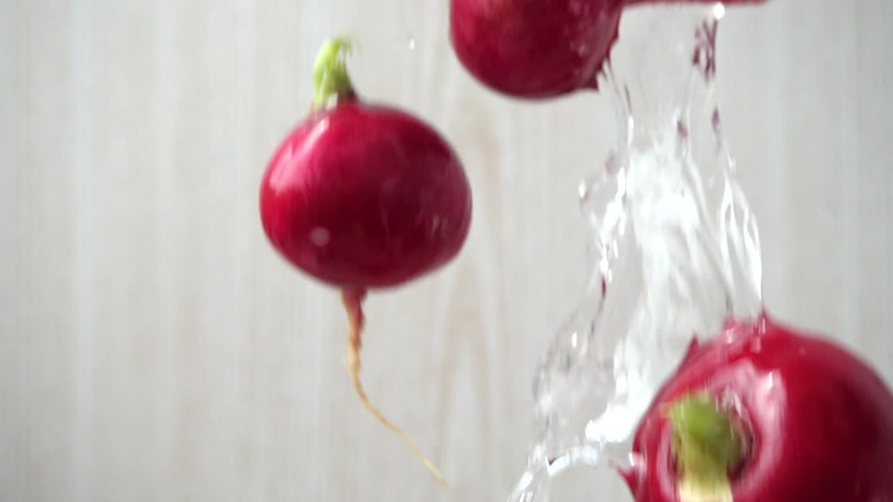 The falling garden radish fruits. Slow motion