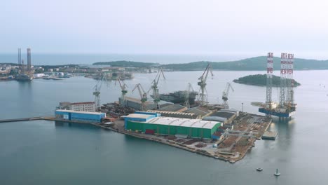 harbour of pula with big cranes and platforms from the air